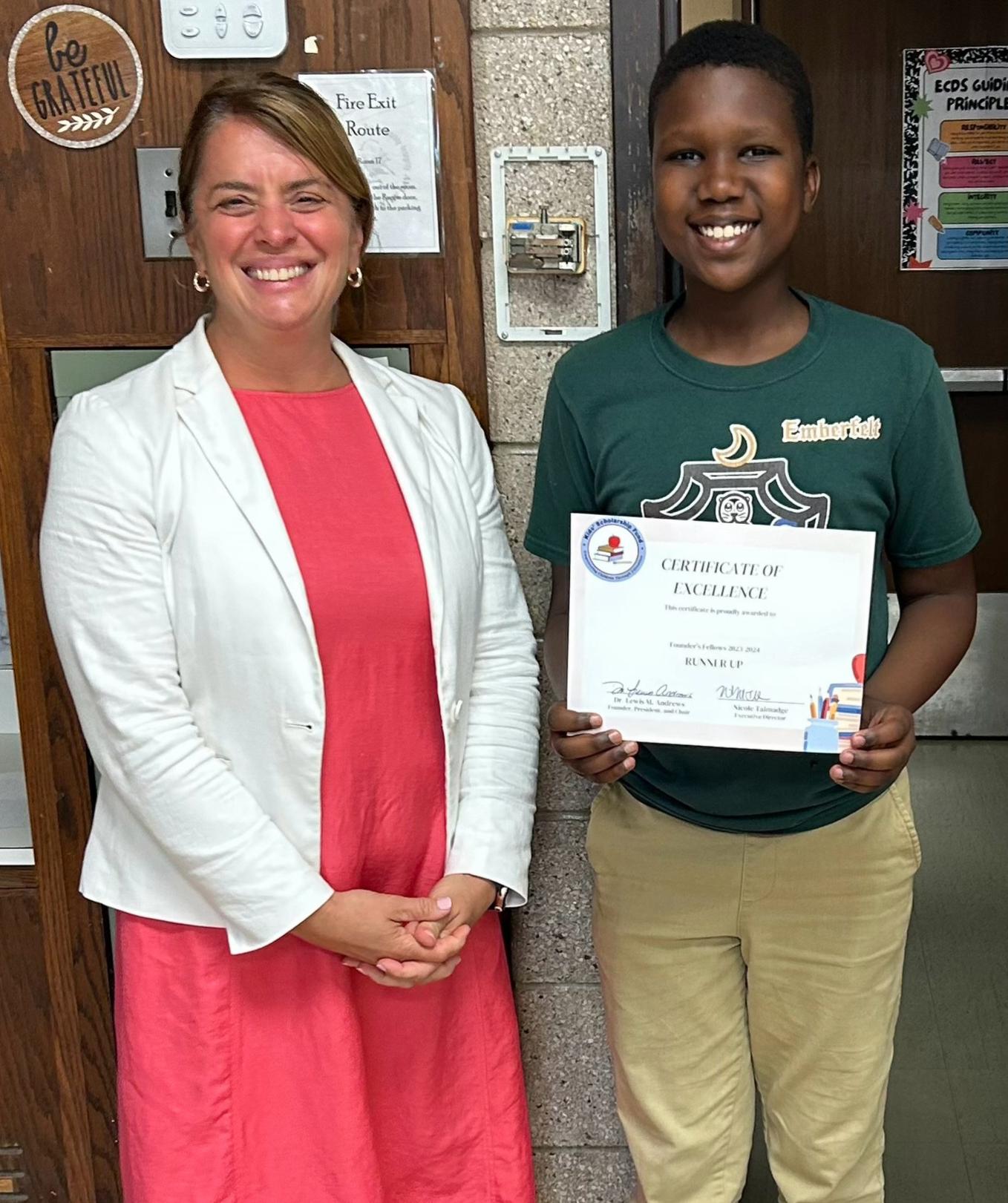 Nicole presenting scholarship certificate to Matthew